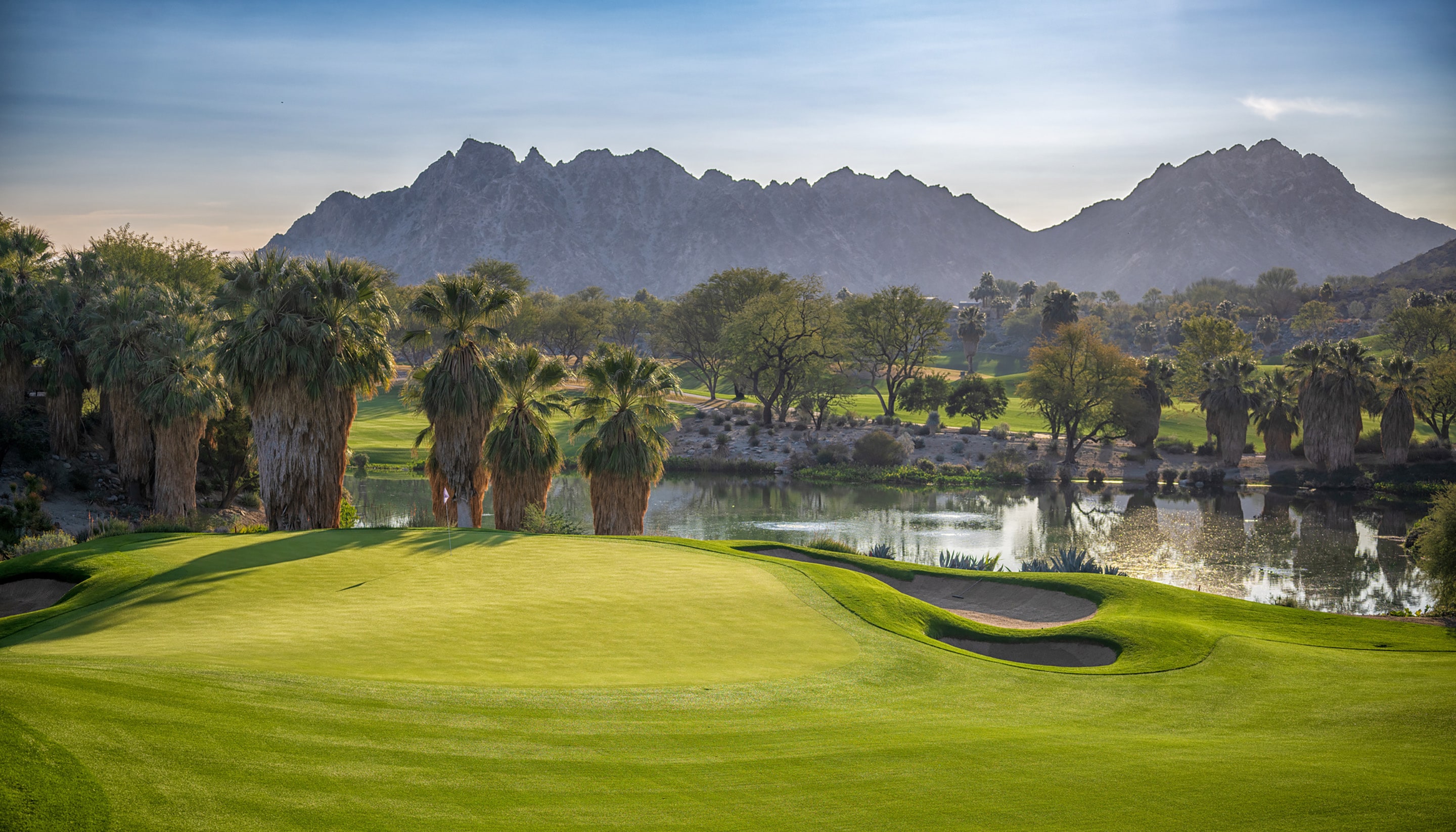 Golf course with mountains in the background